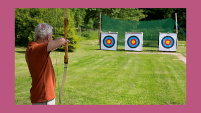 A guest playing archery at Nidd Hall