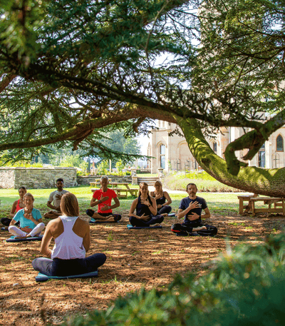 Group sitting outside during a wellness retreat 
