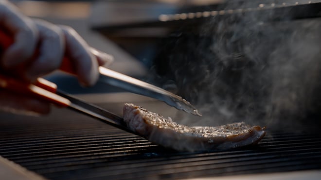 Sizzling steak on the grill