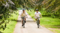 Two guests cycling on the grounds at Heythrop Park